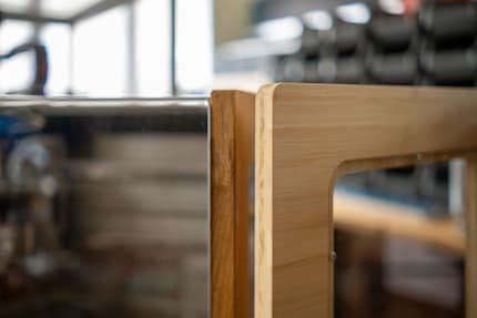 Kevin switched from oak side panels to bamboo. It warps less and isn’t as susceptible to water.