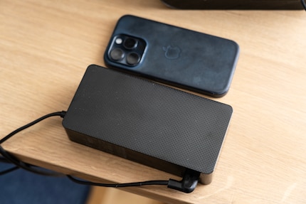 External power supplies allow for lighter devices. But I have to find a place for them on the table. For comparison, an iPhone 15 Pro next to it.
