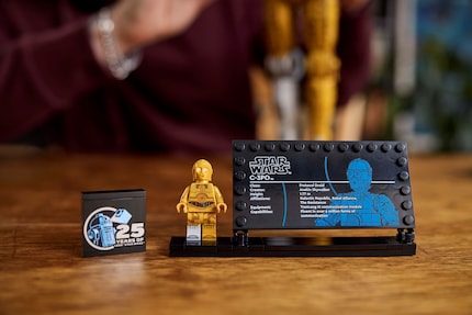 The buildable version also comes with a minifigure of C-3PO.