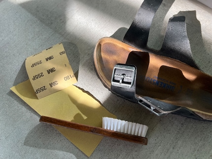Clean the footbed of your Birkenstocks with sandpaper.