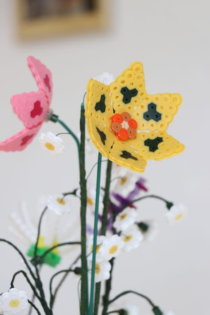 Not made from Lego, but iron beads: eternal garden flowers.
