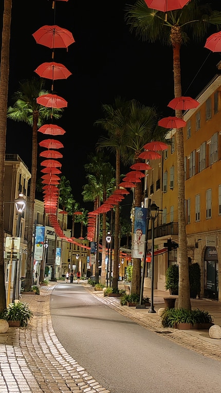 Pink umbrellas characterise the cityscape of Grasse.