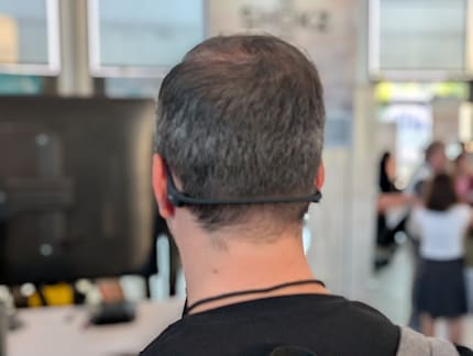 The headband hugs the back of the neck but doesn't pinch.