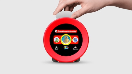 You operate the clock with a rubber knob.