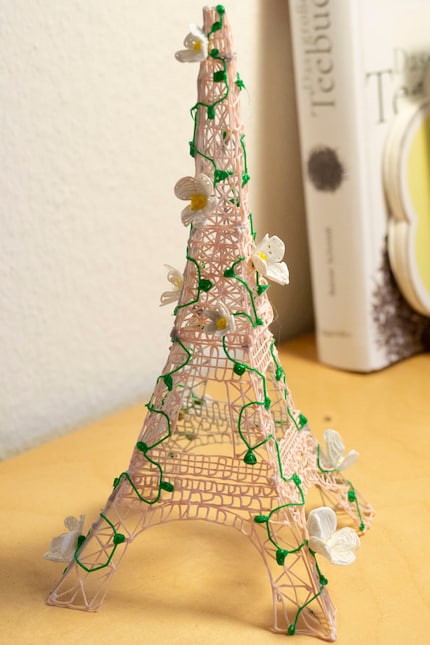 I also stick the flowers to the tower using the pen.