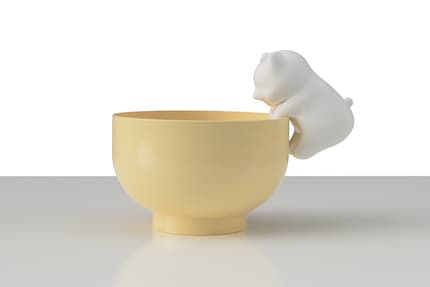 The kitten blows on hot food and drinks so you don't have to.