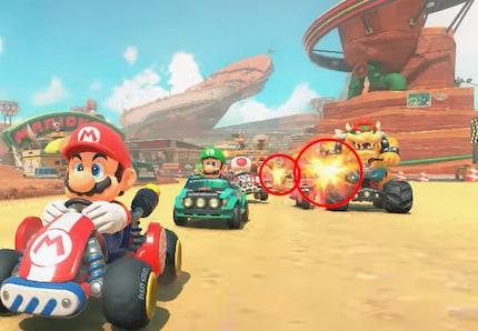 Two bumps and bruises: Peach and Bowser fight in the foreground, with Donkey Kong and Daisy possibly behind them.
