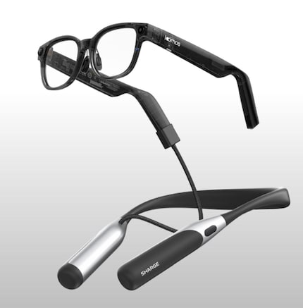 The neck strap has an integrated battery and can charge the glasses.
