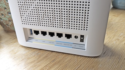 The rear panel offers connections for RJ45 10 Gigabit WAN/LAN, RJ45 10 Gigabit LAN, RJ45 Gigabit WAN/LAN, RJ45 Gigabit LAN and USB-A 3.0.