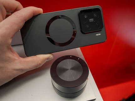 The magnetic ring holds the camera and the two pins transmit power and data.