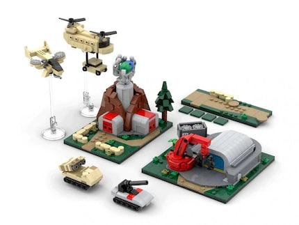 The Construction Yard + Barracks set includes two buildings, two military land vehicles, two helicopters and a road.