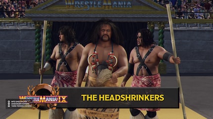Das umfangreiche Roster ist ein großer Pluspunkt des Spiels: Hier kommen die Headshrinkers Samu und Fatu mit ihrem Manager Afa zum Ring.