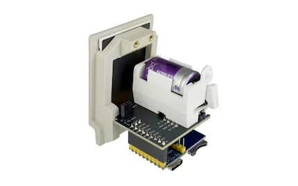 The white battery power module visible above the Raspberry Pi board is optional.