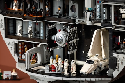 The hangar shows an Imperial Shuttle and a TIE Fighter in action.